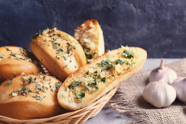 Tasty bread with garlic, cheese and herbs — Stock Photo, Image