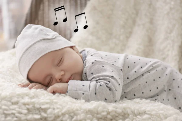 Baby sleeping on plaid — Stock Photo, Image