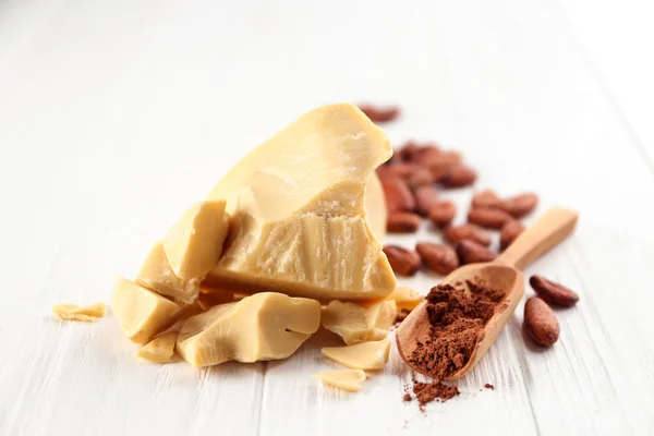 Composition with cocoa butter, powder and beans — Stock Photo, Image