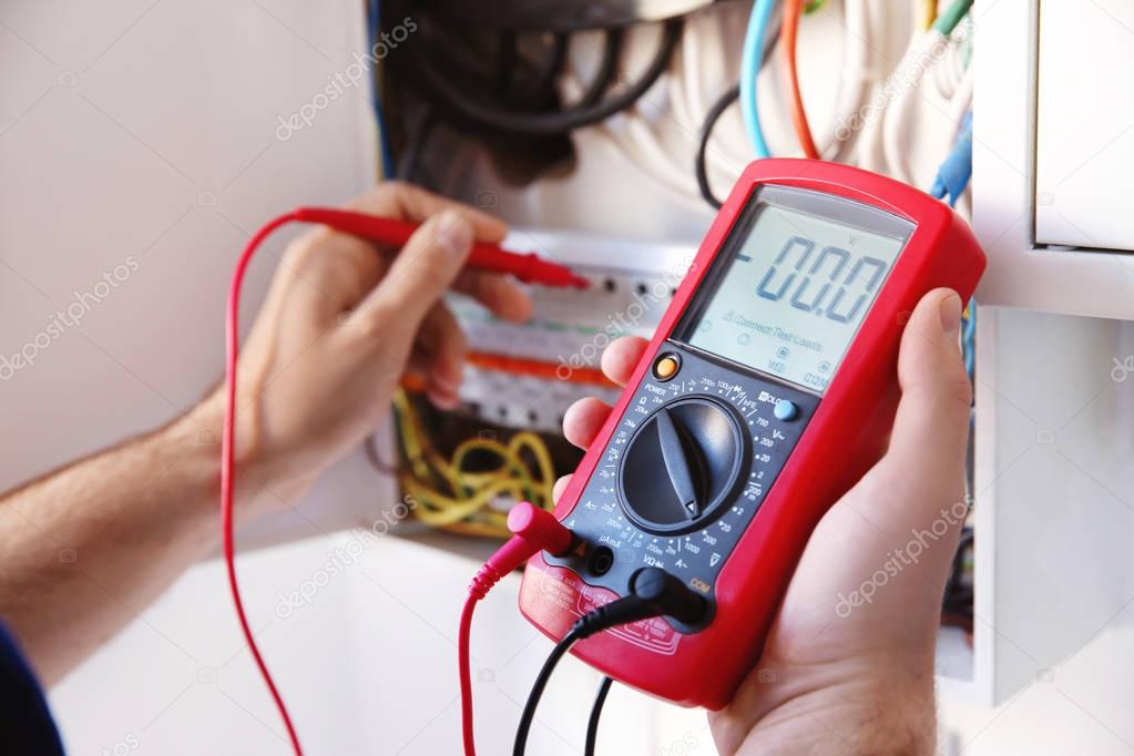 electrician measuring voltage
