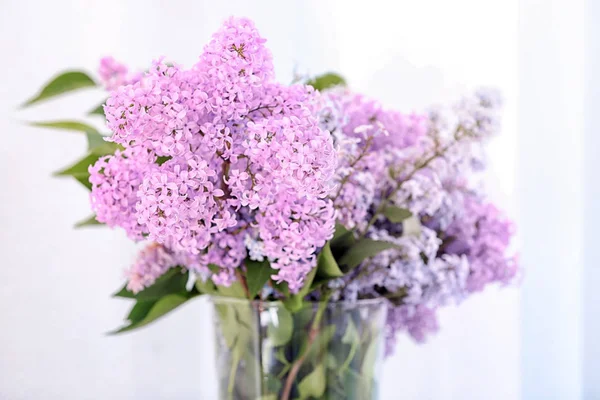 Vase with beautiful lilac flowers — Stock Photo, Image