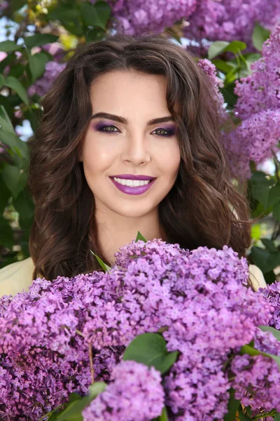 Beautiful young woman with lilac makeup — Stock Photo, Image