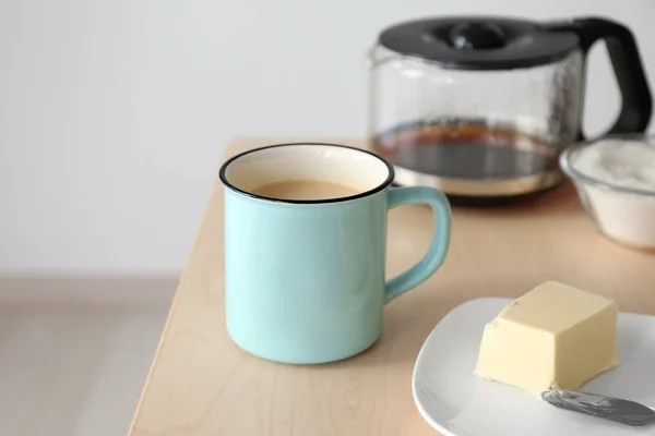 Cup of coffee with butter — Stock Photo, Image