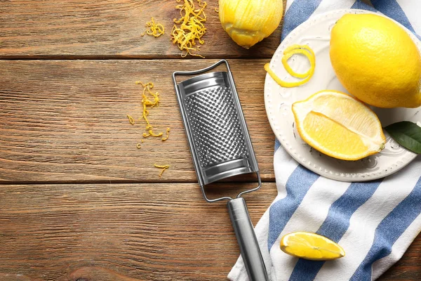 Composition with lemons and grater — Stock Photo, Image
