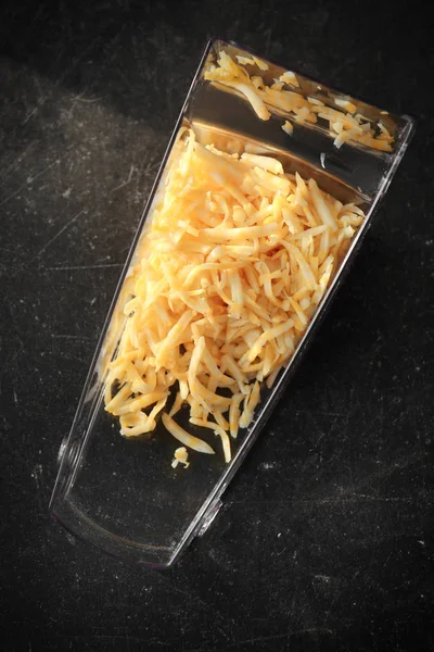 Container with grated cheese — Stock Photo, Image