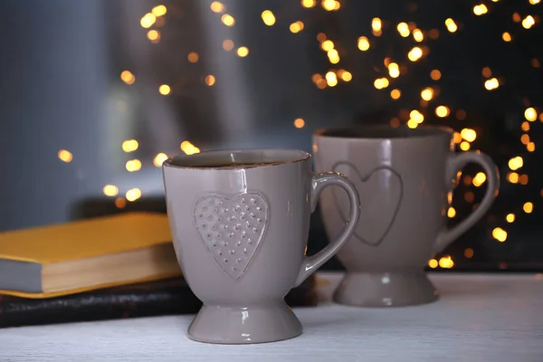 Cups of hot tasty drink — Stock Photo, Image