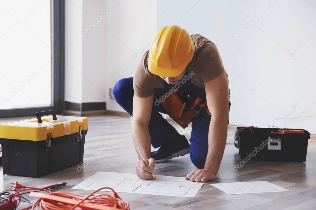 electrician checking drawings