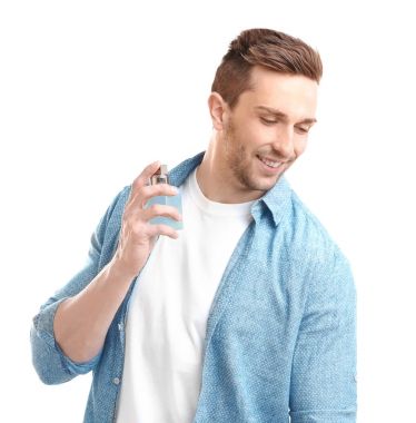 Handsome man using perfume  clipart