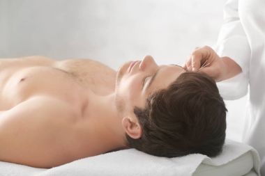 man undergoing acupuncture treatment clipart