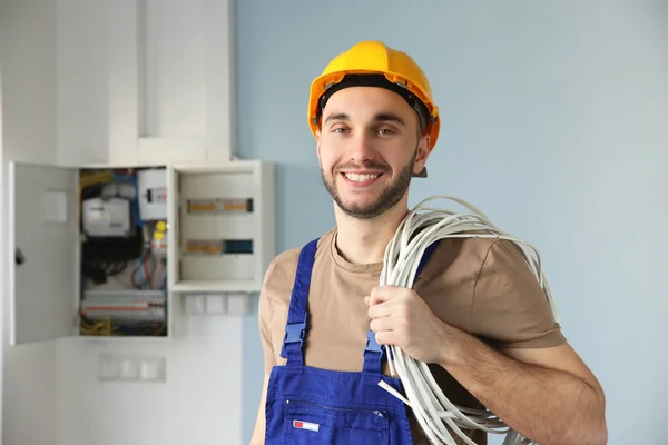 Electrician with bunch of wires — Stock Photo, Image