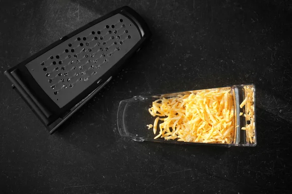 container with grated cheese
