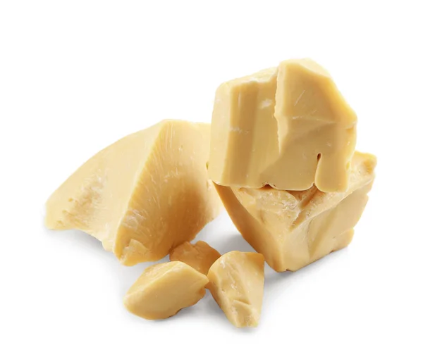 Pedaços de manteiga de cacau sobre fundo branco — Fotografia de Stock