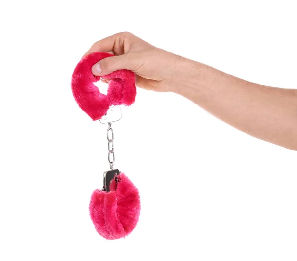 Man holding red furry handcuffs in hand — Stock Photo, Image