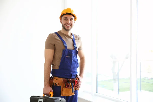 Electrician holding toolbox — Stock Photo, Image