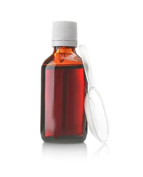 Flaska med hostmedicin och doseringssked — Stockfoto