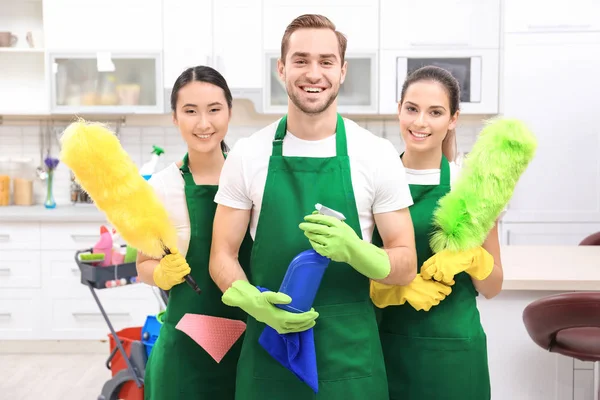 Cleaning service team at work in kitchen — Stock Photo, Image