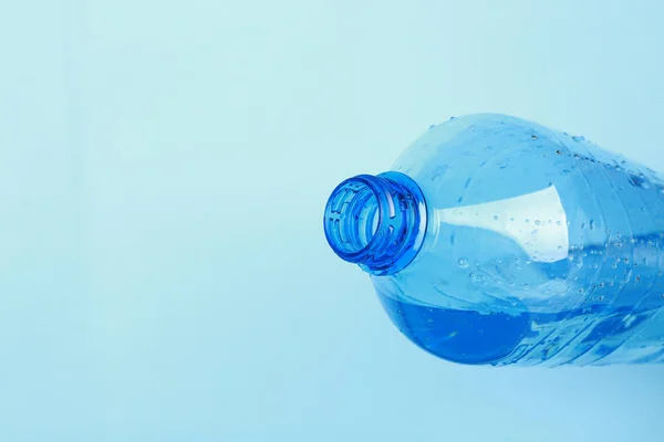 Water pouring from plastic bottle — Stock Photo, Image