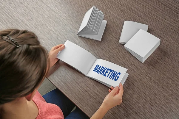 Marketing Concept Woman Sitting Wooden Table Brochures — Stock Photo, Image