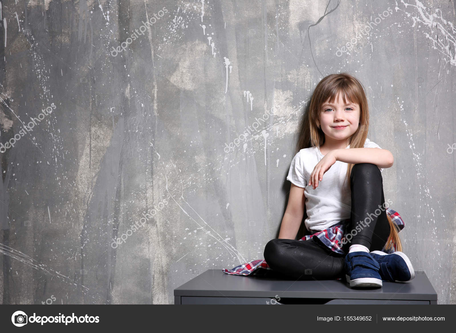 Girl Sitting On Chest Of Drawers Stock Photo C Belchonock 155349652