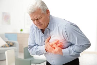 Senior man suffering from chest pain clipart