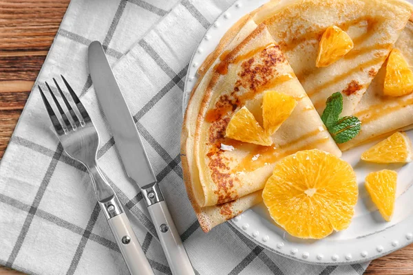 Pancakes with orange slices — Stock Photo, Image