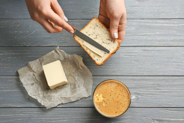 Hands of women with coffee and toasts — Stock Photo, Image