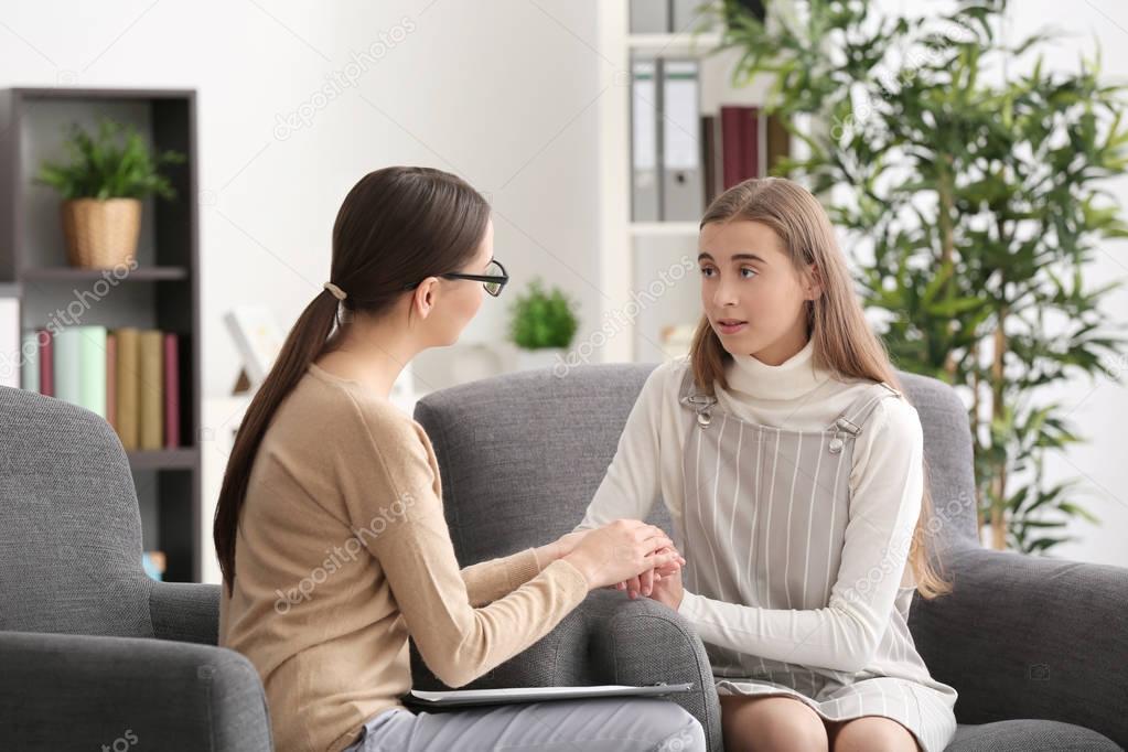 psychologist working with teenager girl