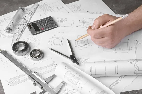 Engineer working with blueprints — Stock Photo, Image