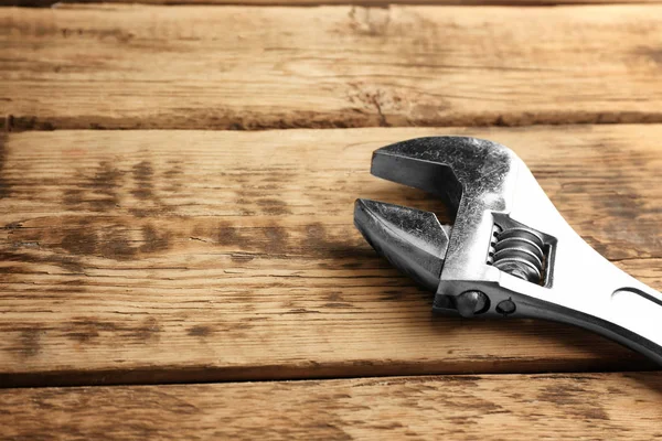 Screw wrench on wooden background — Stock Photo, Image