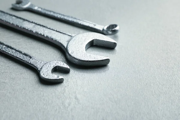 Combination wrenches and spanner on light background — Stock Photo, Image