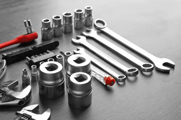 Setting of tools for car repair on grey table — Stock Photo, Image