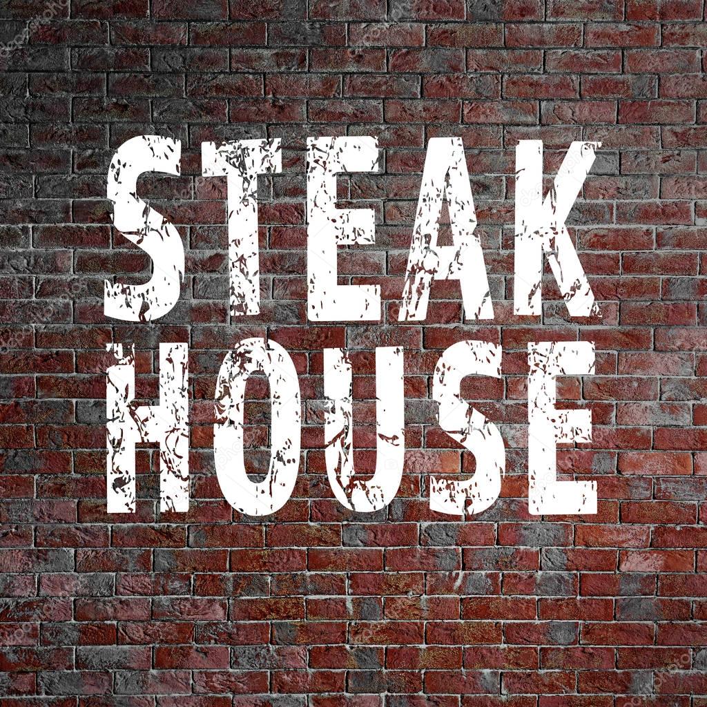 Text STEAK HOUSE on brick wall background