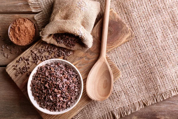 Composition with cocoa nibs — Stock Photo, Image