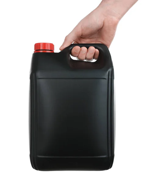 Human hand holding black plastic jerrycan — Stock Photo, Image