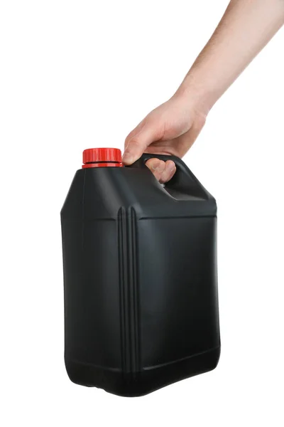 Human hand holding black plastic jerrycan — Stock Photo, Image