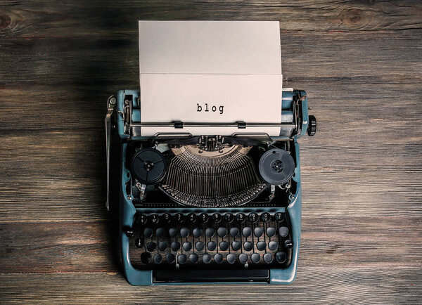 Sheet of paper with word BLOG in typewriter
