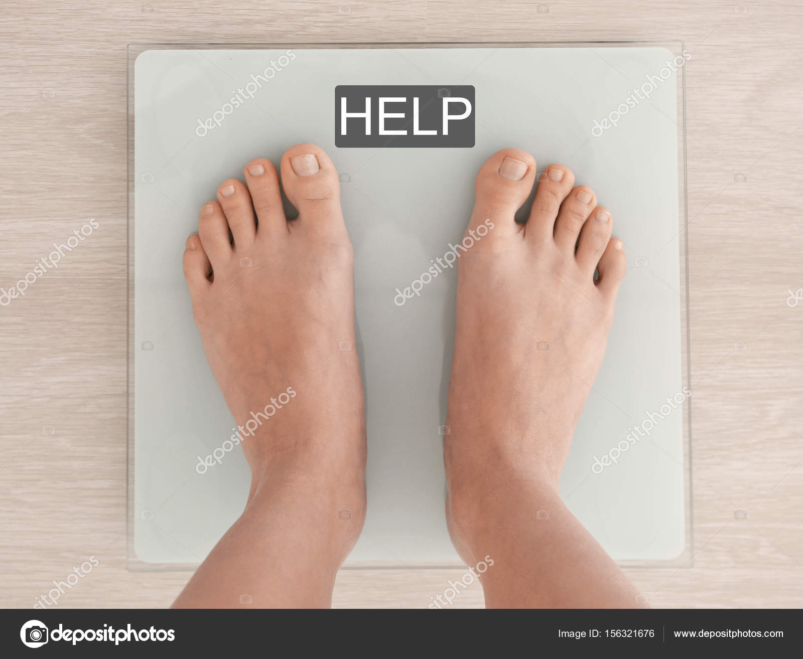 Woman standing on scales Stock Photo by ©belchonock 156321676