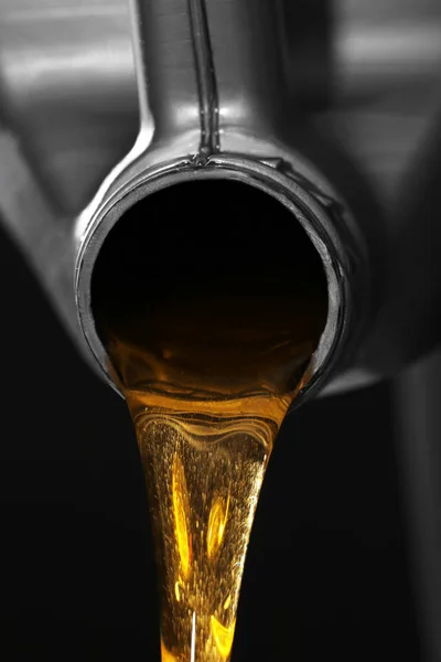 Engine oil pouring from canister — Stock Photo, Image