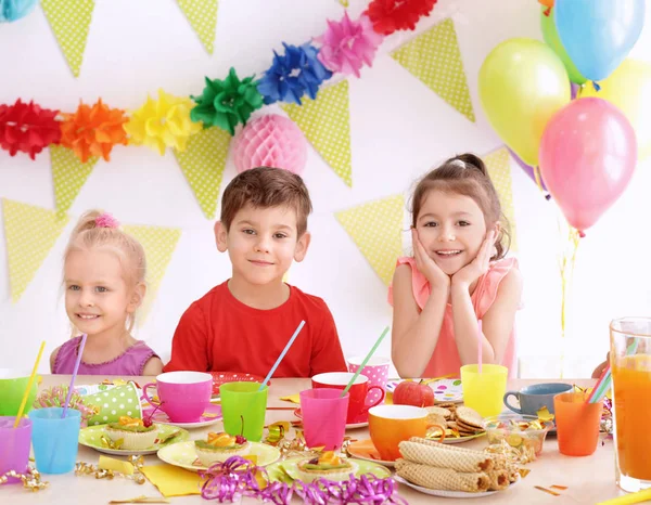 Cute little children celebrating birthday at party — Stock Photo, Image