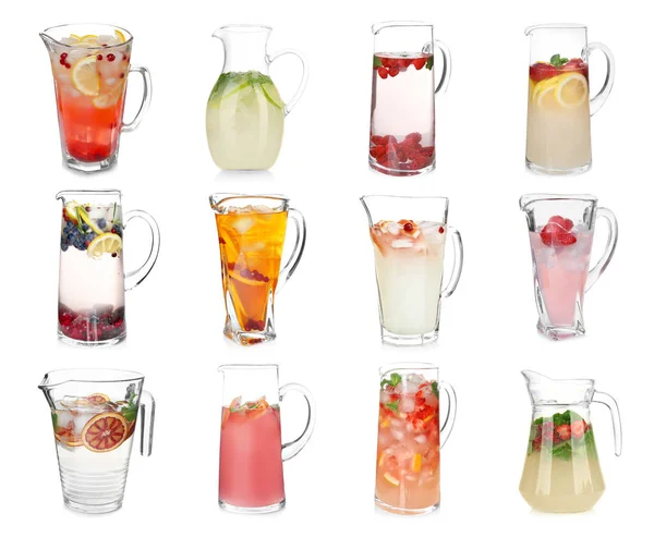 Different drinks in glass jugs — Stock Photo, Image