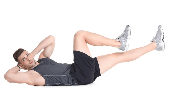 Handsome man doing bicycle crunch — Stock Photo, Image