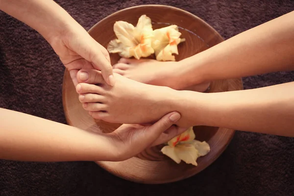 Female feet at spa procedure