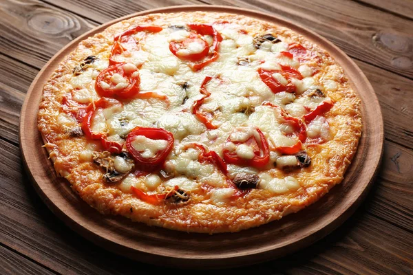 Tasty pizza on table — Stock Photo, Image