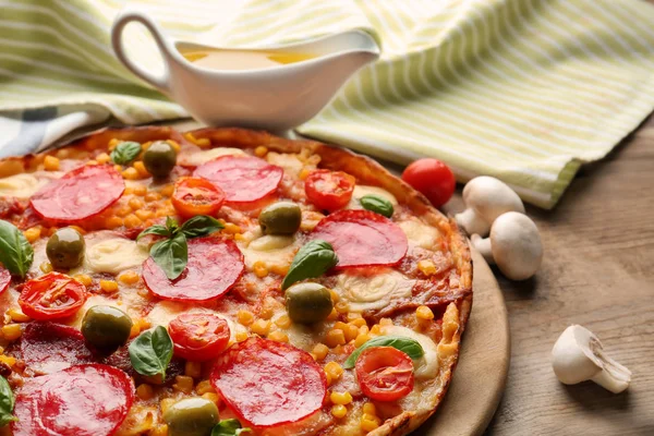 Tasty pizza on table — Stock Photo, Image