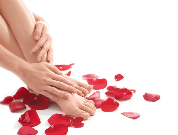 Female legs, hands and petals — Stock Photo, Image