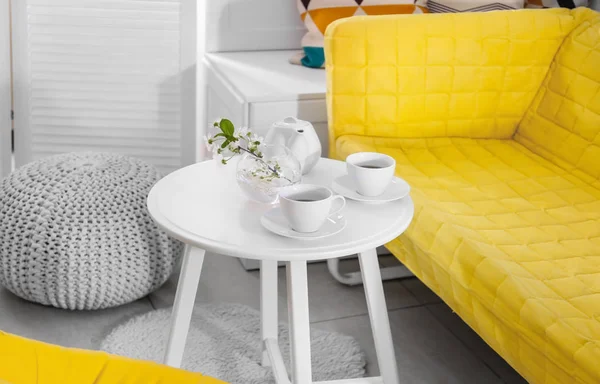 Tea set on table in modern veranda interior — Stock Photo, Image