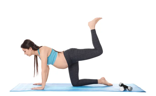 Pregnant woman doing yoga Stock Picture