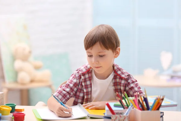 Cute little boy studying at home — Stock Photo, Image