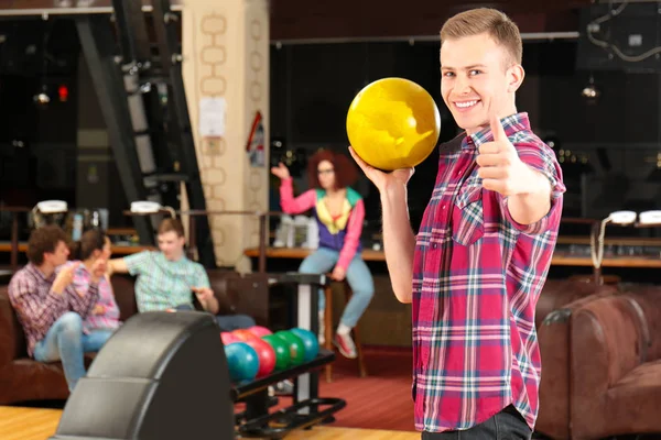 Young man having fun and playing bowling — Stock Photo, Image