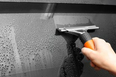 Worker washing car window clipart